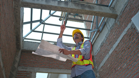 Portrait of engineers inspect and assess the residential home construction site's progress