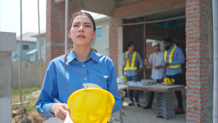 Portrait of engineers work together to assess the residential home construction site's progressの写真素材