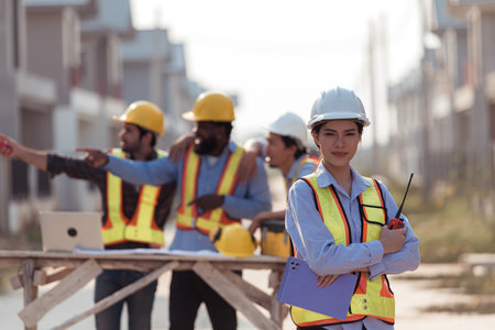 Portrait of engineers work together to assess the residential home construction site's progressの写真素材