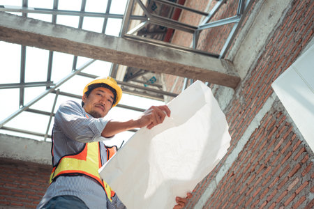 Portrait of engineers inspect and assess the residential home construction site's progressの写真素材