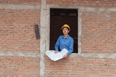 Portrait of engineers inspect and assess the residential home construction site's progressの写真素材