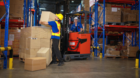 A group of warehouse workers were involved in an accident while on duty, Coworkers offered assistance and first aidの写真素材