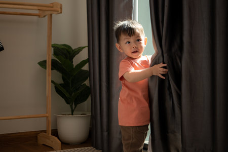 Little boy playing before bathing himの写真素材