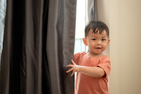 Little boy playing before bathing himの写真素材