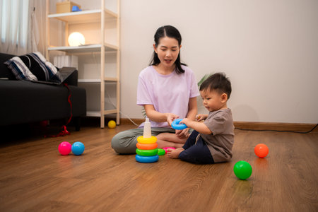 While in vacation at home, a mother engages in activities with little kid