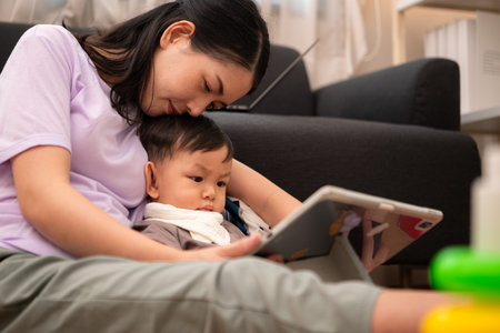 While in vacation at home, a mother engages in activities with little kid