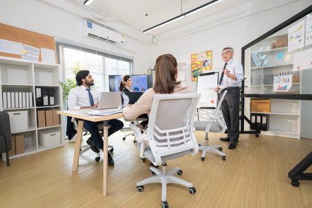 In a contemporary office, a group of senior executives with a mission to approve new projects and monitor the progress of business projectsの写真素材