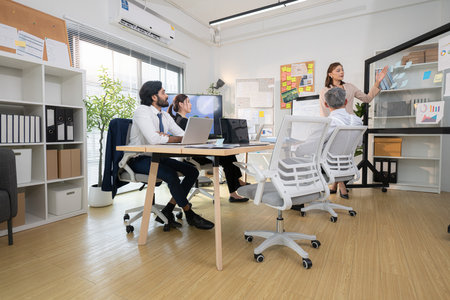 In a contemporary office, a group of senior executives with a mission to approve new projects and monitor the progress of business projectsの写真素材