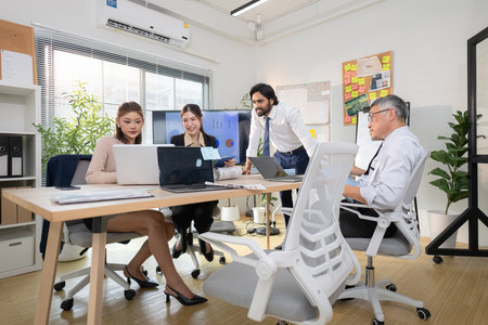 In a contemporary office, a group of senior executives with a mission to approve new projects and monitor the progress of business projectsの写真素材