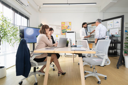 In a contemporary office, a group of senior executives with a mission to approve new projects and monitor the progress of business projectsの写真素材