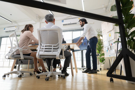 In a contemporary office, a group of senior executives with a mission to approve new projects and monitor the progress of business projectsの写真素材