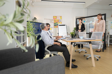 In a contemporary office, a group of senior executives with a mission to approve new projects and monitor the progress of business projectsの写真素材