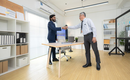 In a contemporary office, two senior executives with a mission to brainstorm and monitor the progress of a business projectの写真素材