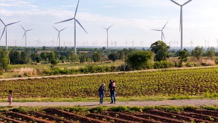 defaultFamily vacation with outdoor activities in the wind turbine fieldの写真素材