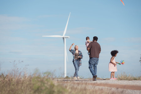 Family vacation with outdoor activities in the wind turbine field