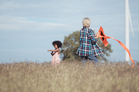 Family vacation with outdoor activities in the wind turbine fieldの写真素材