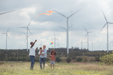 Family vacation with outdoor activities in the wind turbine fieldの写真素材