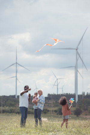 Family vacation with outdoor activities in the wind turbine fieldの写真素材