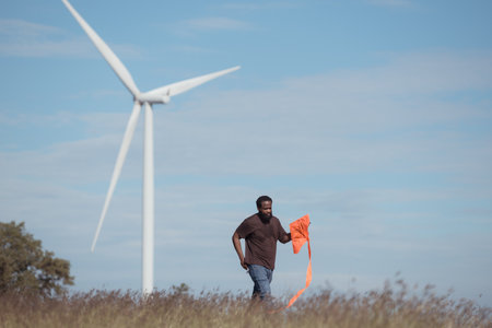 Family vacation with outdoor activities in the wind turbine fieldの写真素材