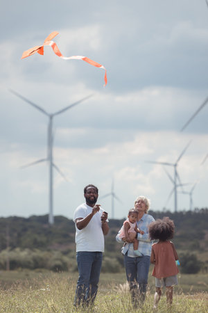 Family vacation with outdoor activities in the wind turbine field