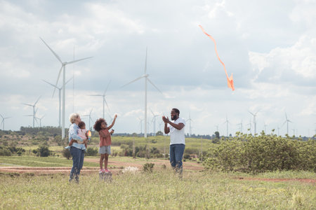 Family vacation with outdoor activities in the wind turbine fieldの写真素材