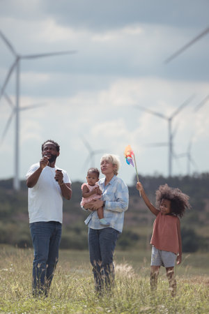 Family vacation with outdoor activities in the wind turbine fieldの写真素材
