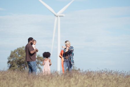 Family vacation with outdoor activities in the wind turbine field