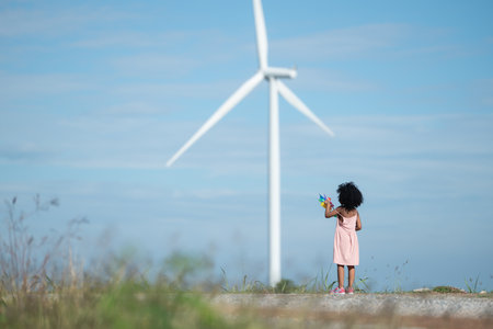 Family vacation with outdoor activities in the wind turbine fieldの写真素材