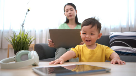 While in vacation at home, a mother engages in activities with little kid