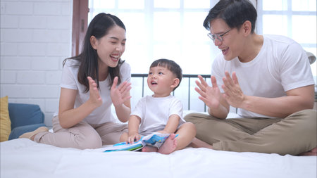 Before putting the kids to bed, parents, and kid unwind and play in the bedroom