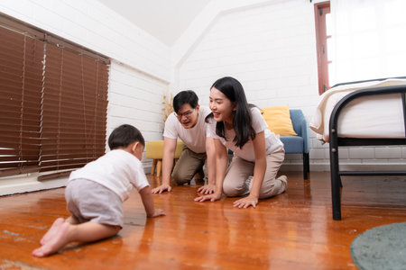 Before putting the kids to bed, parents, and kid unwind and play in the bedroomの写真素材
