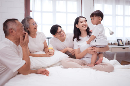 Before putting the kids to bed, parents, grandparents, and kid unwind and play in the bedroom