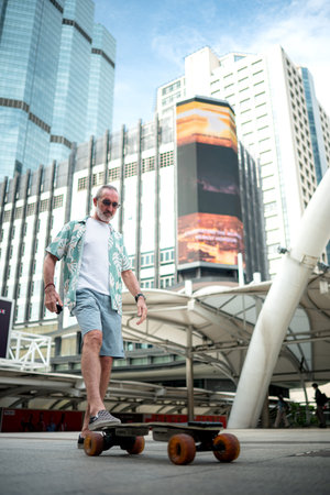Senior man riding an electric skateboard in the city, enjoying urban lifestyle with modern...
