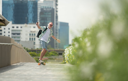 Senior man riding an electric skateboard in the city, enjoying urban lifestyle with modern...