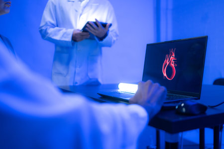 Doctors and medical professionals discussing heart health with futuristic hologram technology in a...