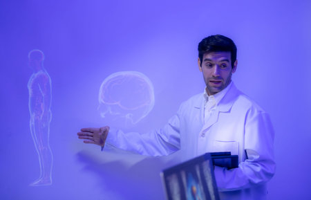 Doctors and medical professionals discuss preparing for physical and brain with futuristic hologram technology in a modern hospital settingの写真素材