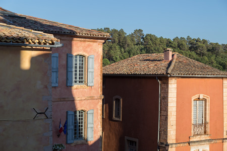 Mediterranean Pastel Colored Houses with Wooden Shutters, Roussillon, Franceの写真素材