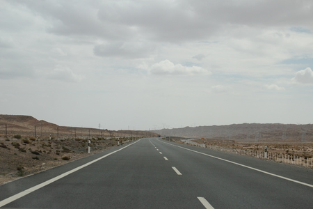 Empty long road in the desertの写真素材