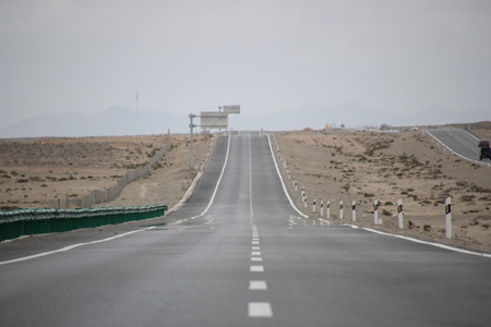 Empty long road in the desertの写真素材