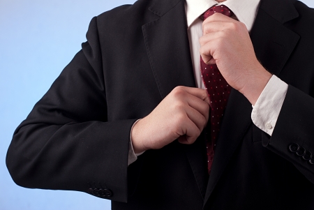 Man binding his tieの写真素材