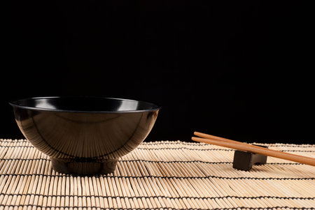 Chopsticks lying on a bamboo mat