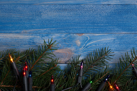 Christmas rustic background - vintage blue planked wood with lights and free text spaceの写真素材