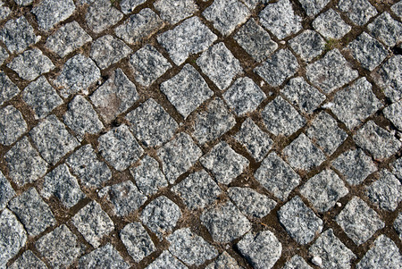 Grey granite cobblestone pavement background or textureの写真素材