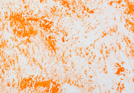 Abstract grungy orange on white wall painted decorの写真素材