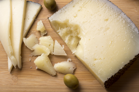 Spanish manchego cheese with olives - top viewの写真素材