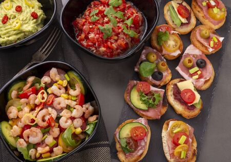 Shrimp salad and sandwiches and other snacks. View from aboveの写真素材