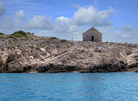 A small historic church dedicated to Saint Ivan on the peninsula of Punta Planka near Razanj and Rogoznica. Dalmatia, Croatia, Europe.の写真素材