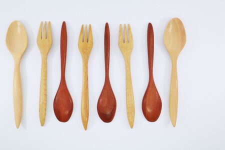 Spoon and fork made of wood, used in kitchen and decorationの写真素材