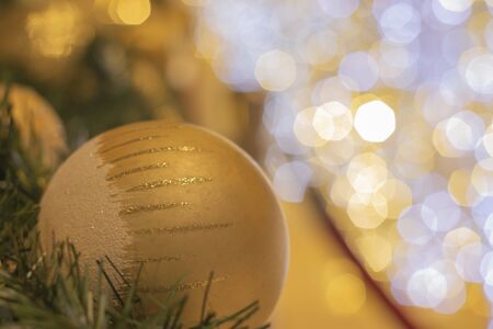 Golden balls to decorate the New Year's festival, the back is a hexagonal bokeh of lights to decorate.の写真素材