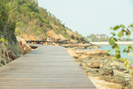 brown wooden bridges along the hillsides rocks on the beach are rocks and  rocky mountains and sea close to island, eco-tourism conceptの写真素材